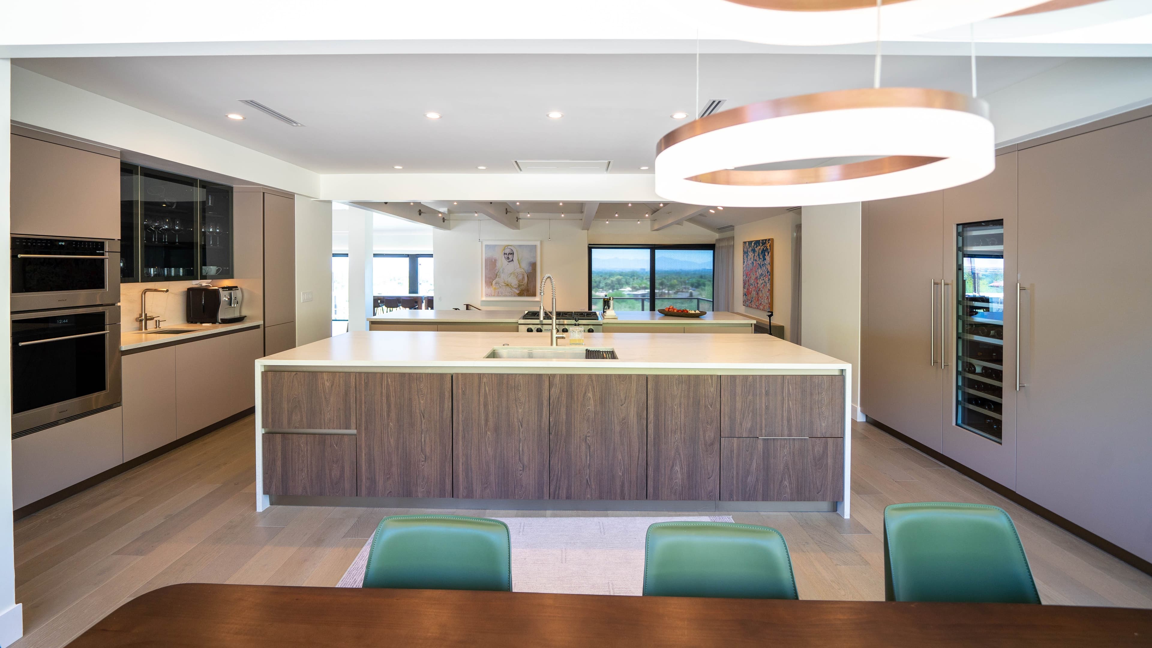 Modern kitchen with a large island, custom cabinetry, and sleek appliances, designed by Febal Casa to highlight expert kitchen design and home remodeling services.